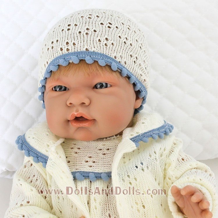 D'Nenes doll 43 cm Mio Mio - Baby doll with beige knitted openwork dress with blue trim