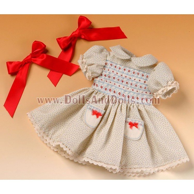 Robe beige à pois bleu ciel.