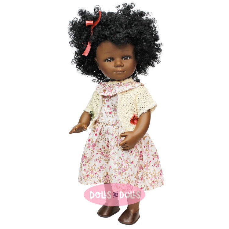 D'Nenes Puppe 34 cm - Marieta mit geblümtem Kleid und weißer Strickjacke